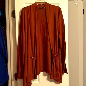 Spice colored cardigan with button detail in the front